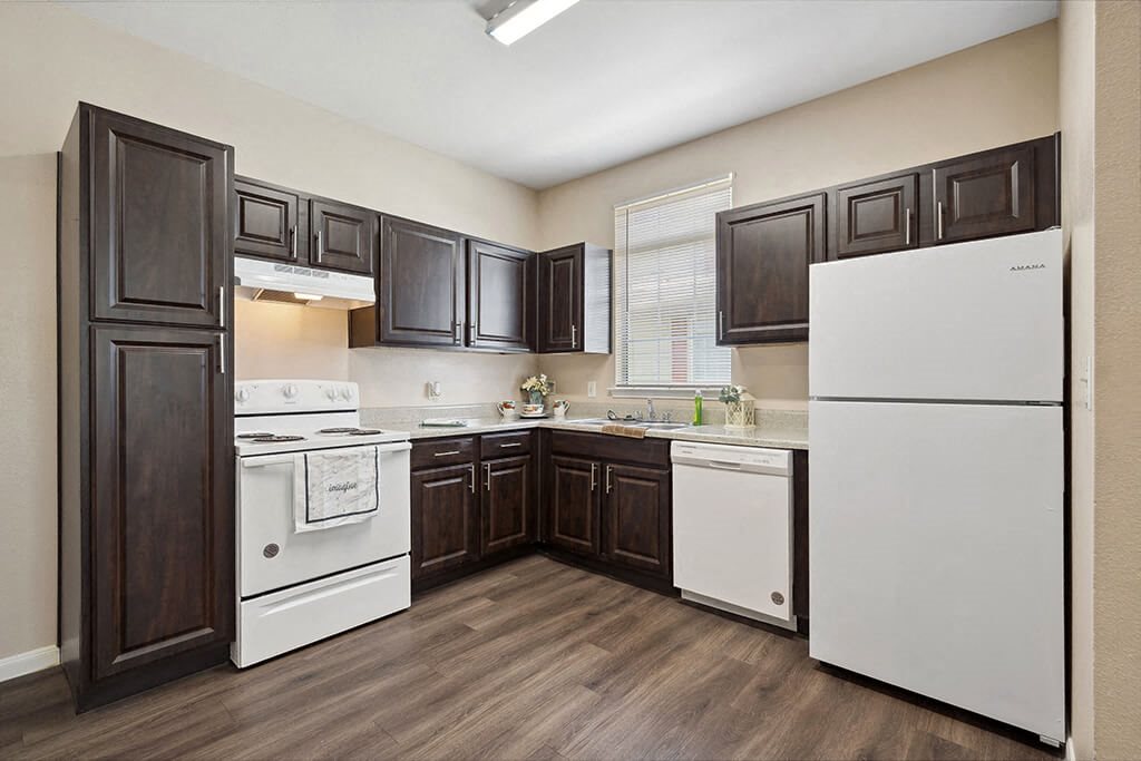 Kitchen with black appliances at Fountains at Tidwell and The Enclave in Houston TX